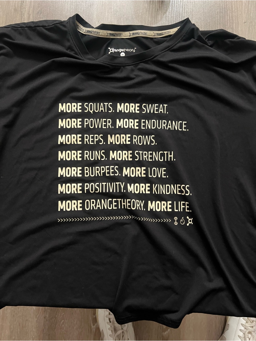 Orangetheory Black Short Sleeve Tee with Cream Motivational Text